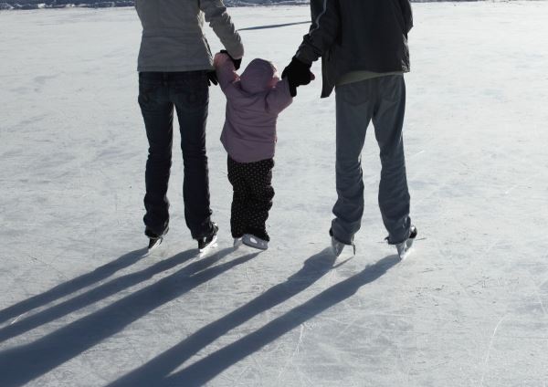 Photo of a family skating together
