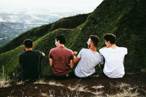 four guys on a hill