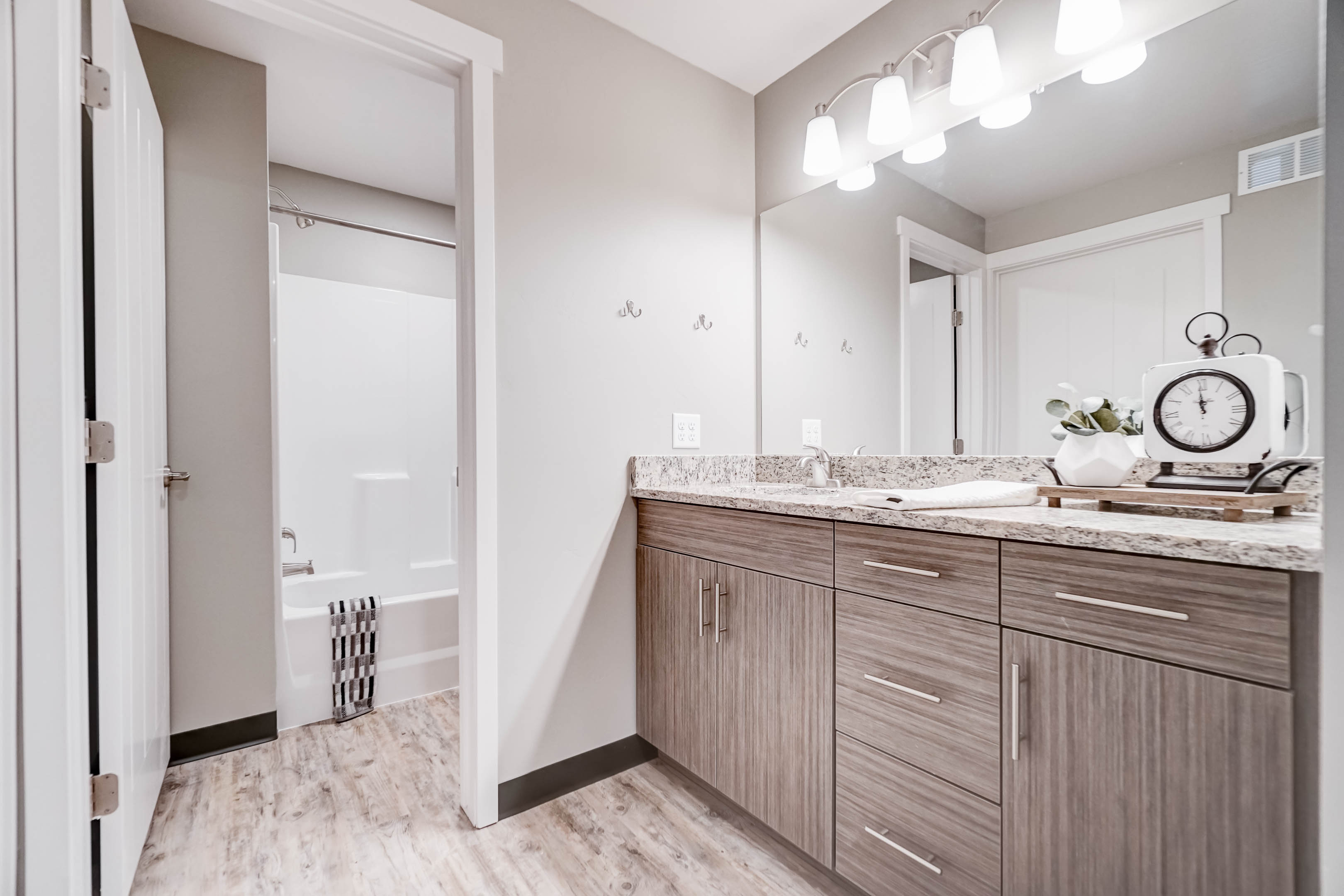 Vanities and bathrooms are separate so someone can be showering while others are getting ready.  Between the two vanities there are more drawers than tenants!