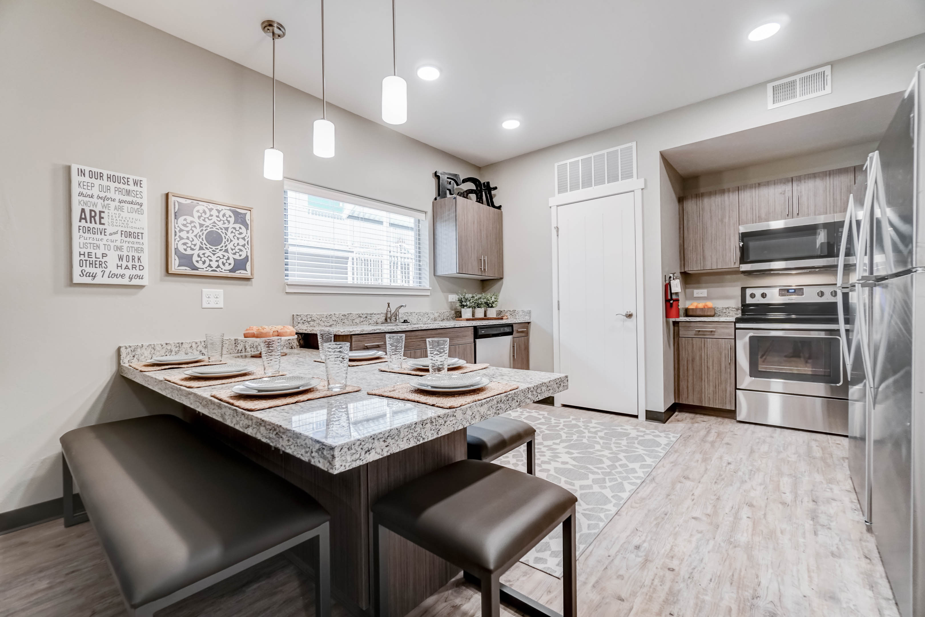 With two full-size refrigerators, granite countertops, lots of beautiful cabinets, stainless steel appliances, and a garbage disposal, the kitchen has everything you need!