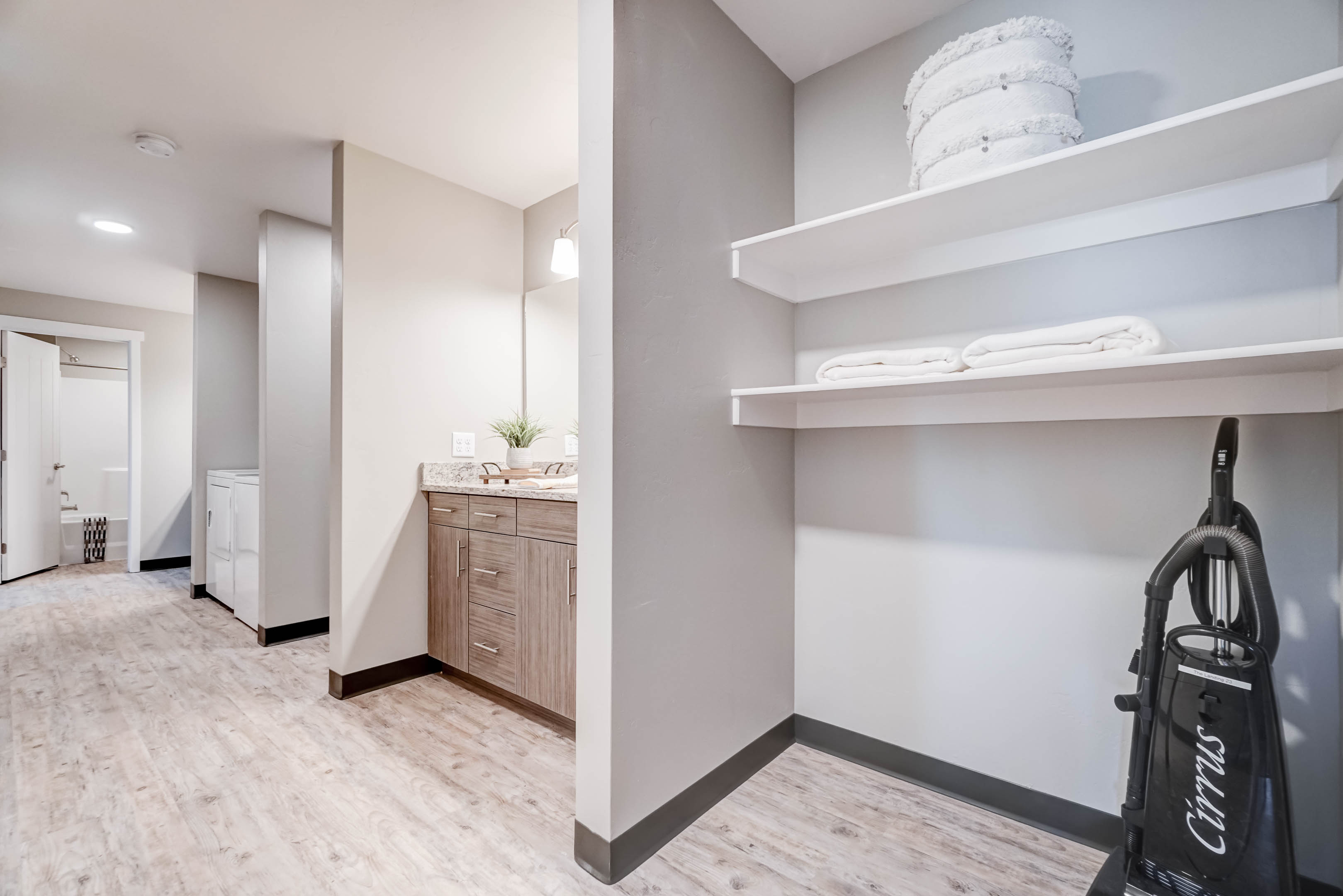 Next to one of the vanities you also have a spacious linen closet, great for storage!