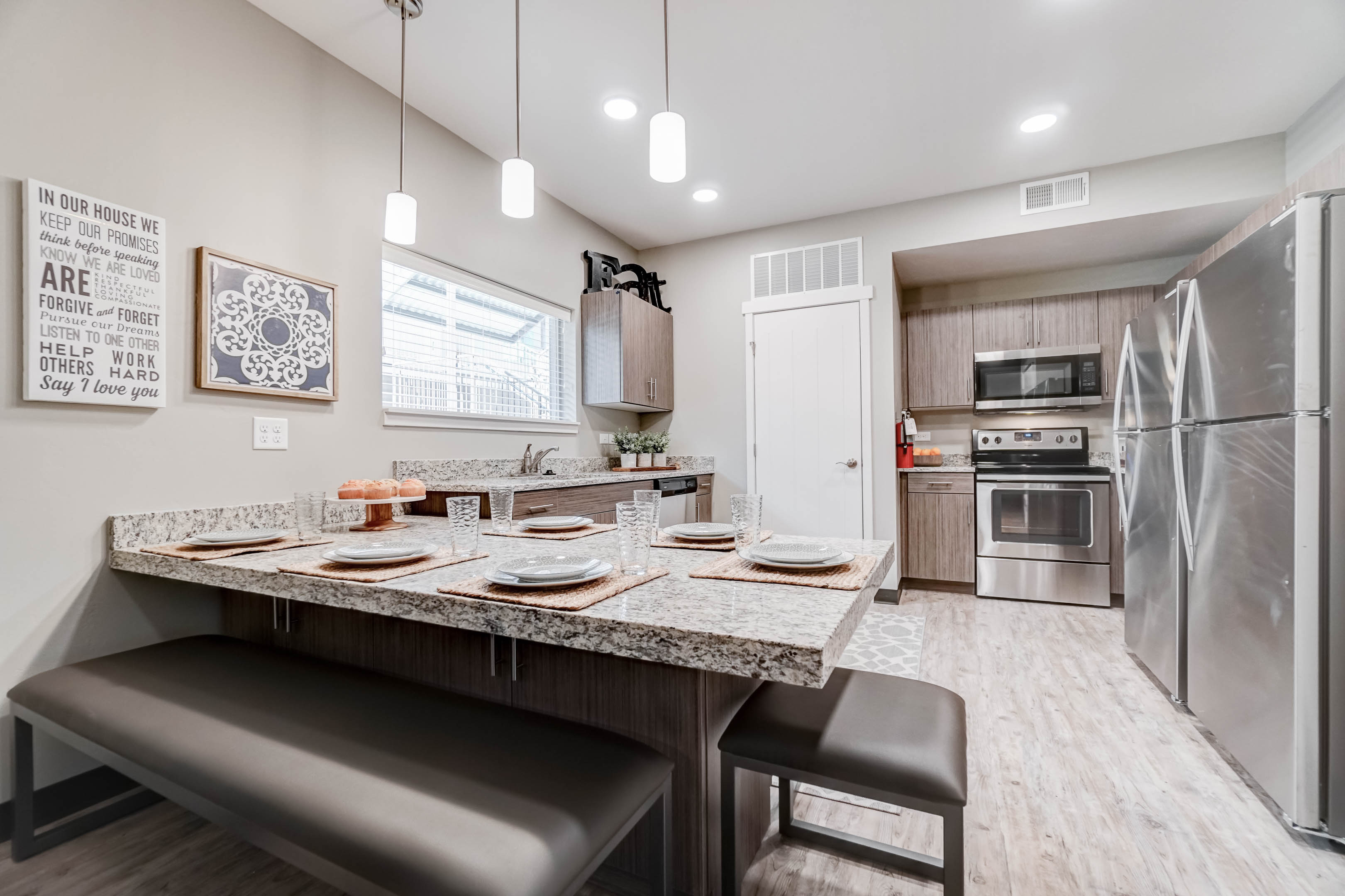 With two full-size refrigerators, granite countertops, lots of beautiful cabinets, stainless steel appliances, and a garbage disposal, the kitchen has everything you need!