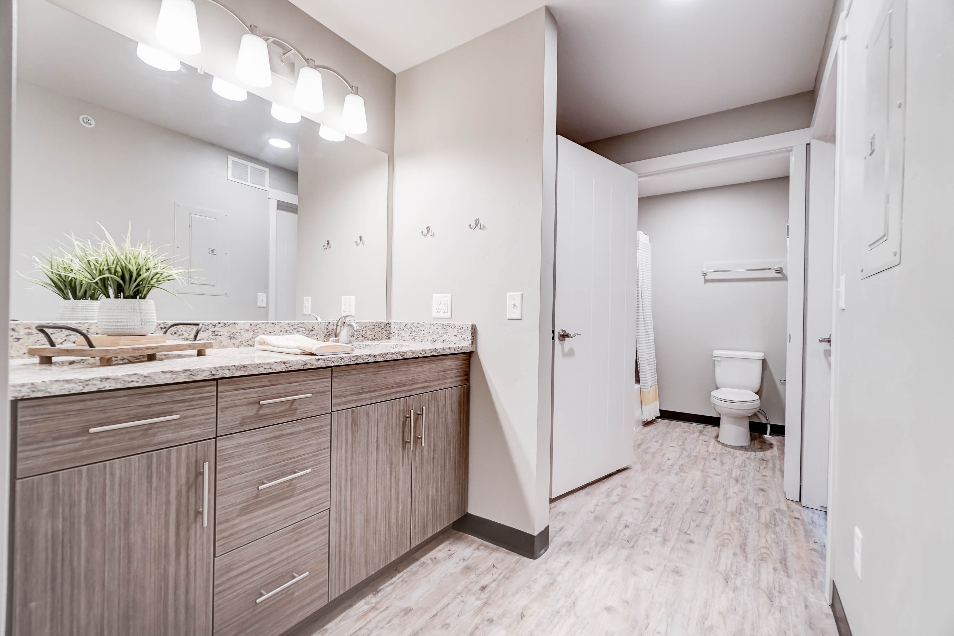 Vanities and bathrooms are separate so someone can be showering while others are getting ready.  Between the two vanities there are more drawers than tenants!